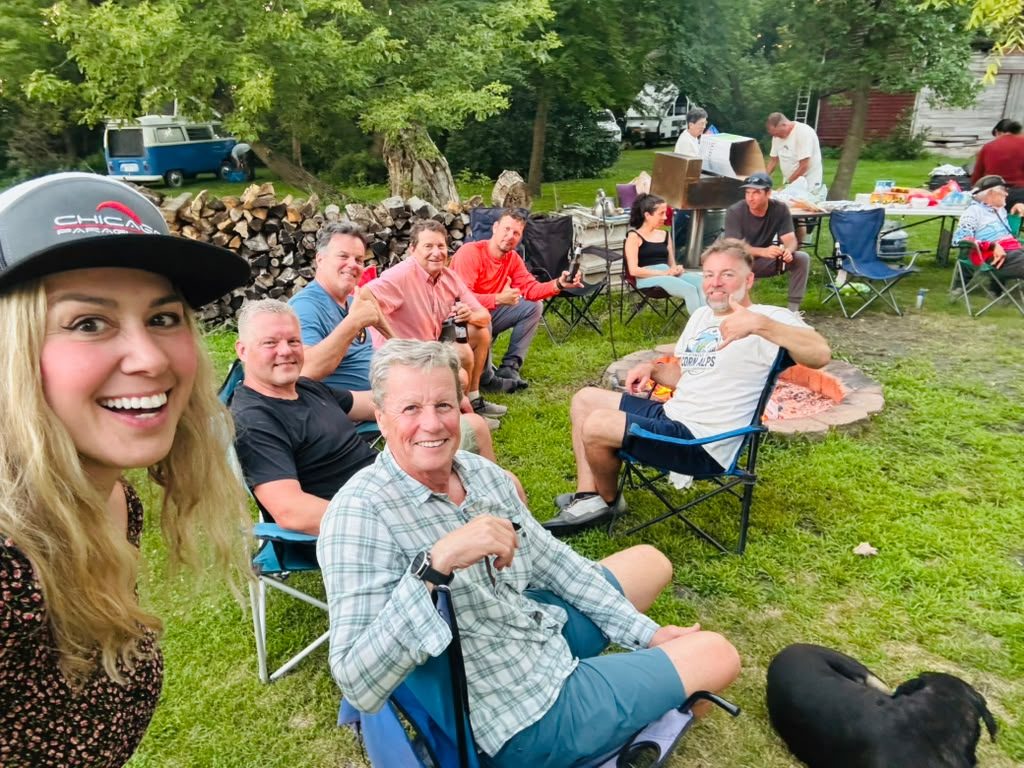 Pilots relaxing around the fire pit at camp