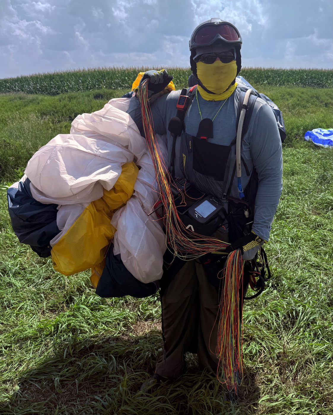 A pilot fully geared up with instruments and radio