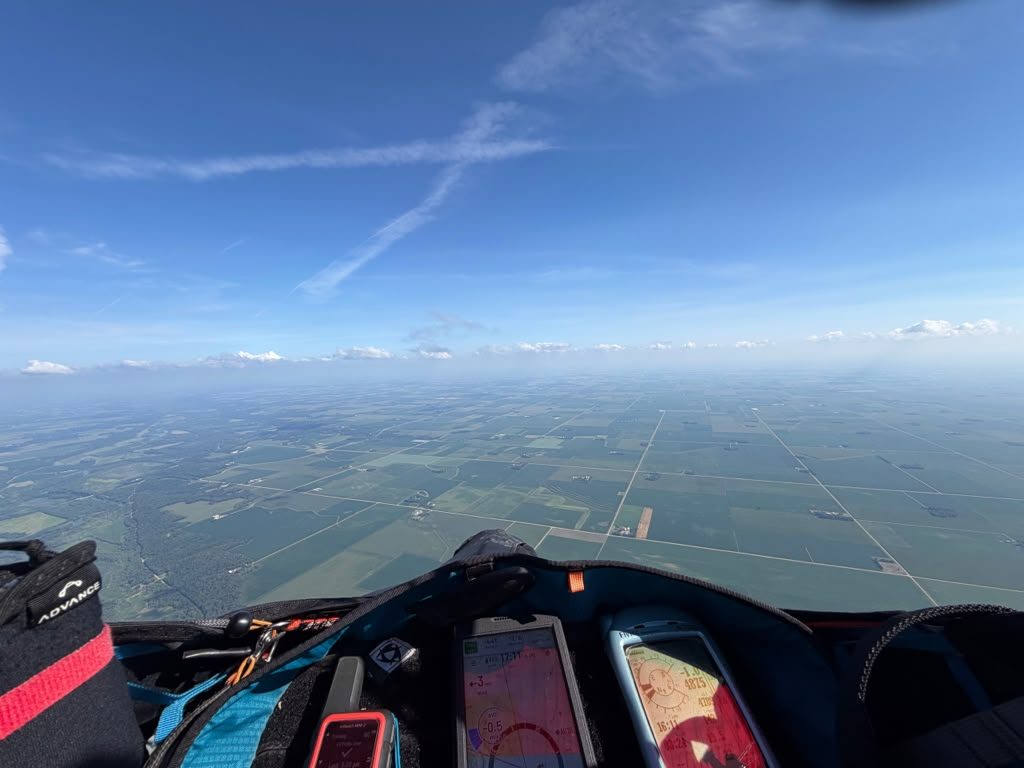 Cockpit view over the grid of farmland below